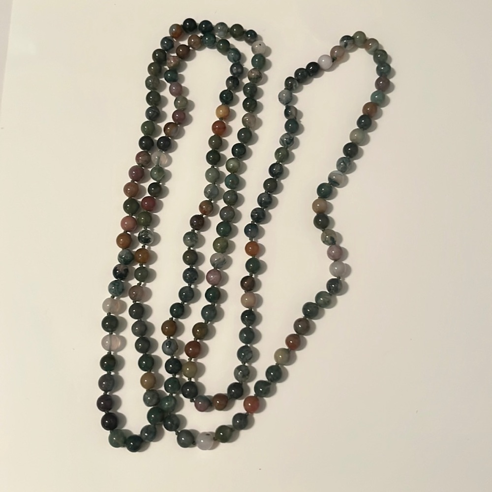 58” strand of hand tied glass beads